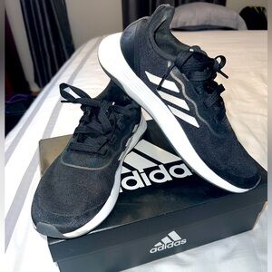 Adidas track shoes.